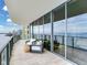 Balcony with outdoor seating and sliding glass doors, offering scenic views and seamless indoor-outdoor living at 2912 W Santiago St # 1504, Tampa, FL 33629