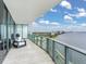 Balcony with seating offers a relaxing space with stunning views of the water and cityscape at 2912 W Santiago St # 1504, Tampa, FL 33629