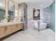 Elegant bathroom with a freestanding tub, double vanity, and refined tile work, creating a spa-like retreat at 2912 W Santiago St # 1504, Tampa, FL 33629