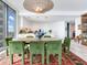 Modern dining area featuring stylish furnishings, a designer chandelier, and scenic views at 2912 W Santiago St # 1504, Tampa, FL 33629