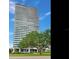 Striking high-rise condominium with wrap-around balconies, manicured lawns, and lush greenery at 2912 W Santiago St # 1504, Tampa, FL 33629