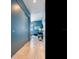 Stylish hallway leading to a living area with bright blue walls and scenic outdoor views at 2912 W Santiago St # 1504, Tampa, FL 33629