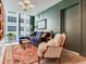 Living room featuring stylish furniture, modern lighting, and a large window at 2912 W Santiago St # 1504, Tampa, FL 33629