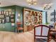 Stylish living room with custom built-in shelving and a gallery wall, creating a warm and inviting atmosphere at 2912 W Santiago St # 1504, Tampa, FL 33629