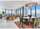 Spacious open-plan living and dining area with floor-to-ceiling windows offering stunning water views at 2912 W Santiago St # 1504, Tampa, FL 33629