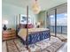 Elegant main bedroom with a four-poster bed, water views, and a plush area rug for added comfort at 2912 W Santiago St # 1504, Tampa, FL 33629