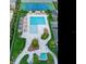 Aerial view of pool, tennis court, lounge area with well manicured landscaping at 2912 W Santiago St # 1504, Tampa, FL 33629