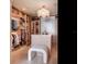 Organized walk-in closet with custom shelving, central island, and stylish lighting for a luxurious feel at 2912 W Santiago St # 1504, Tampa, FL 33629