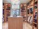 Bright walk-in closet featuring custom shelves, drawers, and a stylish central island, providing ample storage at 2912 W Santiago St # 1504, Tampa, FL 33629