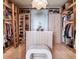 Spacious walk-in closet with custom shelving, drawers, and a central island for organizing clothes and accessories at 2912 W Santiago St # 1504, Tampa, FL 33629