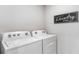 Modern laundry room with front-load washer and dryer at 2954 Rock Sound St, Bradenton, FL 34208