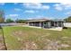 A home with a large backyard and screened-in patio offers great outdoor living and entertaining space at 3012 Bonita Dr, Plant City, FL 33566