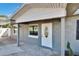 Charming front entrance features a white front door, covered porch, and well-maintained exterior at 3012 Bonita Dr, Plant City, FL 33566