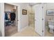 Well-lit bathroom with a shower and walk-in closet for ample storage at 3106 Francoa Dr, Odessa, FL 33556