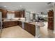 Gourmet kitchen with a stainless steel sink and stainless steel appliances overlooking the living room at 3106 Francoa Dr, Odessa, FL 33556