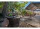 Relaxing backyard featuring a patio area with seating, a hot tub, and lush landscaping at 3116 W Wallcraft, Tampa, FL 33611