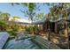 Inviting backyard features a hot tub, patio, and lush landscaping perfect for outdoor relaxation at 3116 W Wallcraft, Tampa, FL 33611