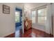 Bright bathroom features a wood vanity, and a peek into the adjacent water closet with blue tiled floors at 3116 W Wallcraft, Tampa, FL 33611