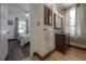Hallway view of bathroom with hardwood floors, vanity, and bedroom with natural light at 3116 W Wallcraft, Tampa, FL 33611