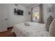 Bedroom featuring hardwood floors, TV, large window with bright natural light at 3116 W Wallcraft, Tampa, FL 33611