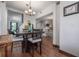 Dining room showcasing hardwood floors and an open layout, connecting to other living spaces at 3116 W Wallcraft, Tampa, FL 33611
