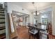 Dining area seamlessly connects to the open-concept kitchen, featuring a modern table and stylish chairs at 3116 W Wallcraft, Tampa, FL 33611