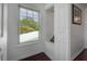 Light and airy hallway with hardwood floors, a window and a built in seat at 3116 W Wallcraft, Tampa, FL 33611