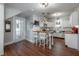 Well-lit kitchen with white cabinetry, stainless steel appliances, a butcher block island, and hardwood floors at 3116 W Wallcraft, Tampa, FL 33611