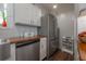 Kitchen features stainless steel appliances, wood countertops and tile backsplash at 3116 W Wallcraft, Tampa, FL 33611