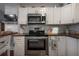 Updated kitchen features stainless appliances, custom cabinets, and wood countertops at 3116 W Wallcraft, Tampa, FL 33611