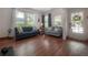 Bright living room with hardwood floors, ample seating, and natural light at 3116 W Wallcraft, Tampa, FL 33611