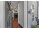Cozy entry view featuring hardwood floors, a fireplace, and living room access at 3116 W Wallcraft, Tampa, FL 33611