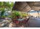 Spacious backyard patio features dining and seating areas with lush landscaping at 3116 W Wallcraft, Tampa, FL 33611