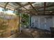 Covered patio with a view of the backyard shed and hot tub at 3116 W Wallcraft, Tampa, FL 33611