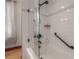 A close up of the shower featuring white subway tile and modern, matte black shower fixtures at 3116 W Wallcraft, Tampa, FL 33611