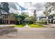 Inviting home with manicured lawn, mature trees and a brick walkway leading to the front porch at 3116 W Wallcraft, Tampa, FL 33611