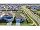 An aerial view shows a single story home with a landscaped yard in a peaceful residential neighborhood at 35524 Quartz Lake Dr, Zephyrhills, FL 33541