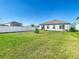Large backyard with a well-manicured lawn and fencing at 35524 Quartz Lake Dr, Zephyrhills, FL 33541