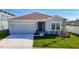 Charming single-story home with a well-maintained lawn and attached two-car garage at 35524 Quartz Lake Dr, Zephyrhills, FL 33541