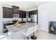 Kitchen with stone countertops and dark cabinets at 35524 Quartz Lake Dr, Zephyrhills, FL 33541
