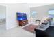 Open living room with tile floors and lots of natural light at 35524 Quartz Lake Dr, Zephyrhills, FL 33541
