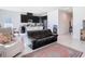 Open-concept living space with dark cabinets, large island, and tile flooring at 35524 Quartz Lake Dr, Zephyrhills, FL 33541