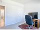 Bright office space featuring neutral walls, plush carpeting, and an office chair suited for a productive workspace at 35524 Quartz Lake Dr, Zephyrhills, FL 33541