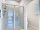 Spacious shower with glass doors and tiled walls in a modern bathroom at 35524 Quartz Lake Dr, Zephyrhills, FL 33541