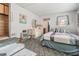 Comfortable bedroom featuring carpet, a large bed, and an ensuite bathroom at 37042 Lois Ave, Zephyrhills, FL 33542