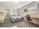Inviting bedroom with a cozy ambiance and a view of the ensuite bathroom at 37042 Lois Ave, Zephyrhills, FL 33542