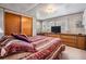 Cozy bedroom featuring a built-in dresser, large closet, and comfortable bed at 37042 Lois Ave, Zephyrhills, FL 33542