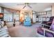 Inviting living room open to the kitchen featuring neutral color palette and natural light at 37042 Lois Ave, Zephyrhills, FL 33542