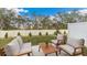 Relaxing patio area with comfortable seating and a lush green lawn, perfect for outdoor enjoyment at 4117 Goldheart Blvd, Bradenton, FL 34208