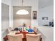 Bright dining room showcasing a wooden table and chairs, perfect for Gathering meals at 4611 Anaconda Dr, New Port Richey, FL 34655